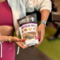 Woman Holding Power Up Protein Mix Trail Mix
